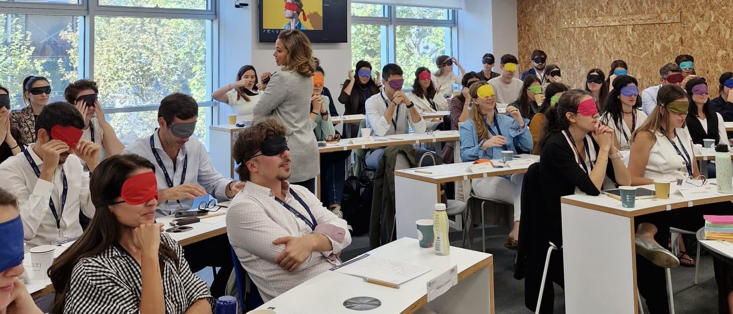 Sam Hernández García running a workshop in which participants wear colourful blindfolds